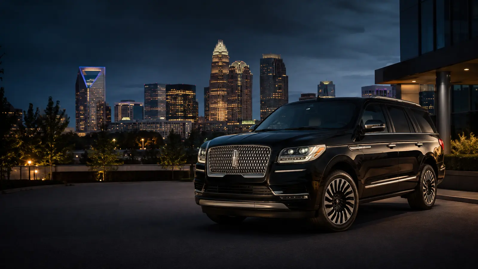 Black Lincoln Navigator with the Charlotte skyline